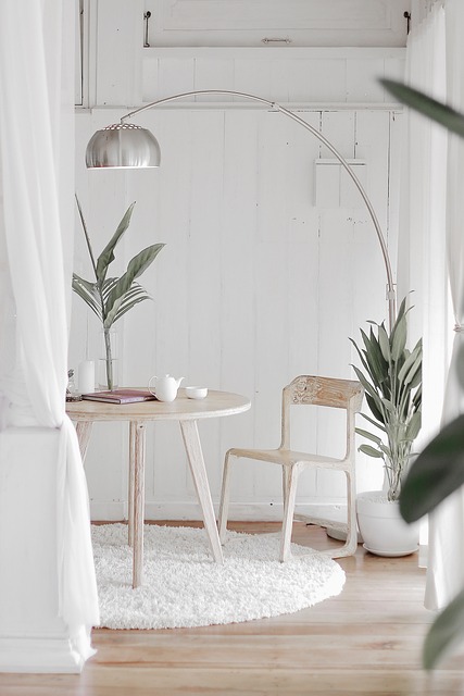 home wellness ideas with cozy lighting, plant, and organized living space